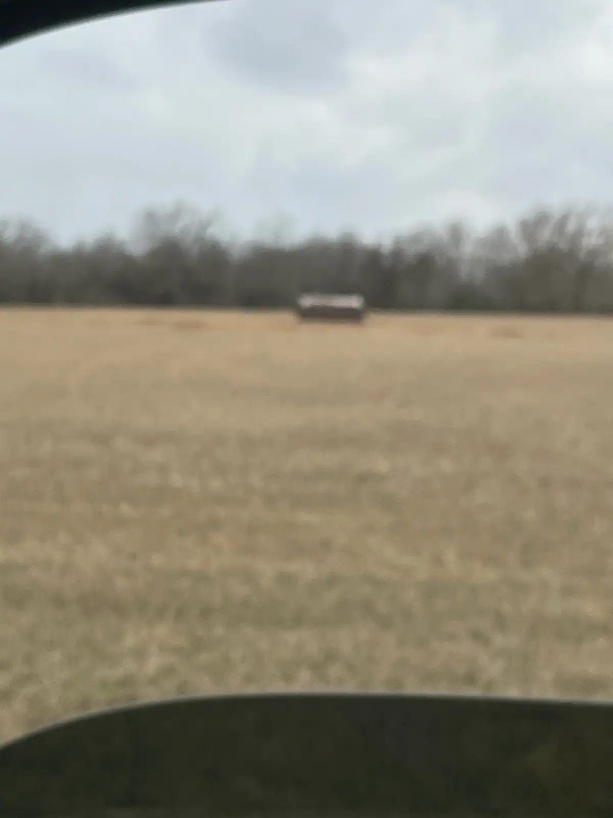 View from the tractor cab across a freshly mowed field near Granbury, TX